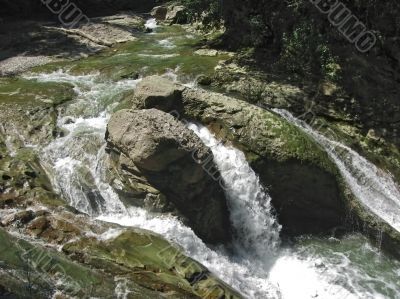 Waterfall between the rocks. The Caucasus nature Waterfall between the rocks. The Caucasus nature