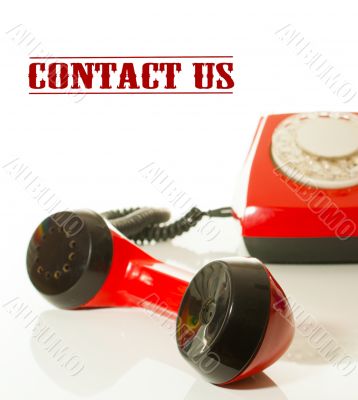 Red old fashioned telephone - Contact us concept