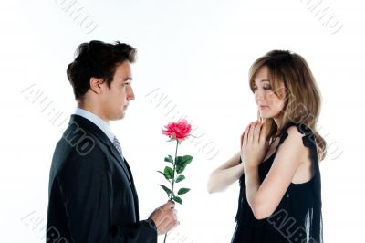 man gives a woman flowers