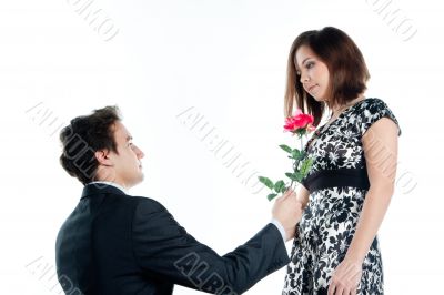 man gives a woman flowers