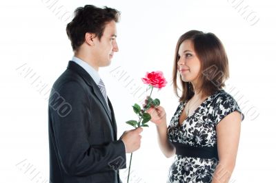 man gives a woman flowers