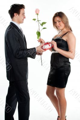 man gives a woman flowers