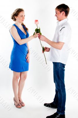 man gives a woman flowers