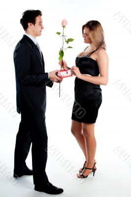 man gives a woman flowers