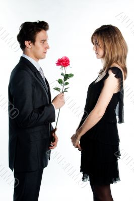 man gives a woman flowers