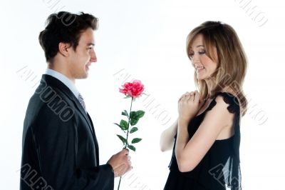 man gives a woman flowers