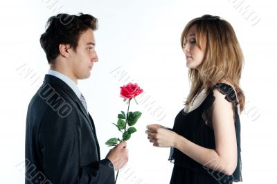 man gives a woman flowers