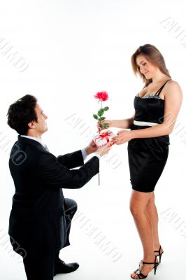 man gives a woman flowers