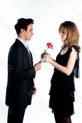 man gives a woman flowers