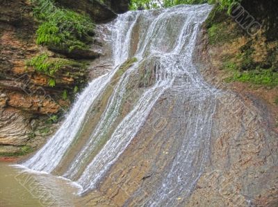 Waterfall between the rocks. The Caucasus nature Waterfall between the rocks. The Caucasus nature