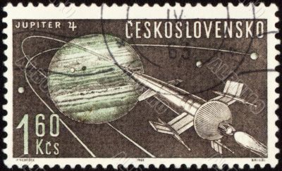 Postage stamp with Planet Jupiter and spaceship