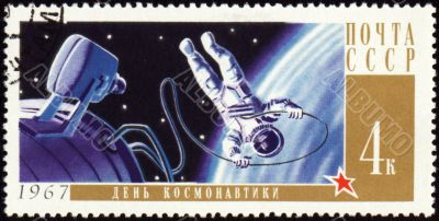 Postage stamp with Cosmonaut in open space