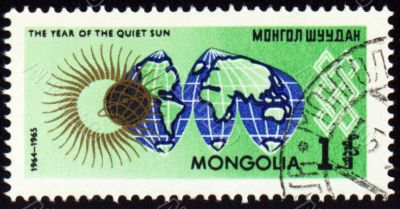 Post stamp with map Globe and symbol of the Sun