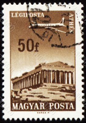 Flying plane above the Athens on post stamp
