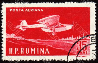 Flying vintage medical amphibian on post stamp Flying vintage medical amphibian on post stamp