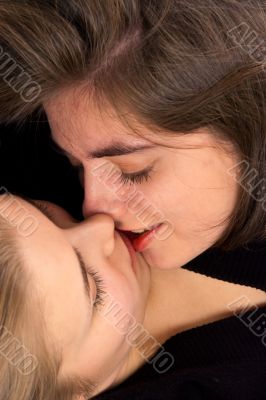 two girls kissing