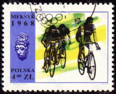 Group of cyclists on polish post stamp