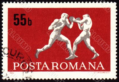 Fighting of two boxers on post stamp