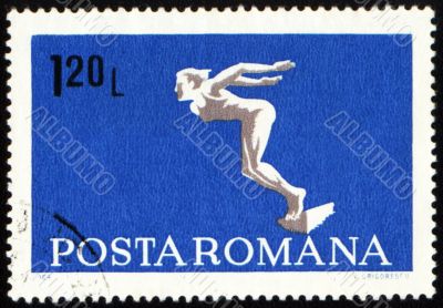 Diving swimmer on post stamp