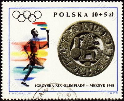Sportsman with torch on post stamp of Poland