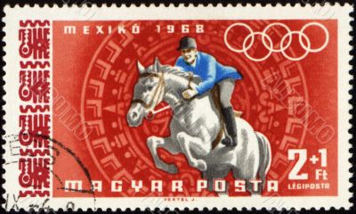 Jockey riding horse on post stamp