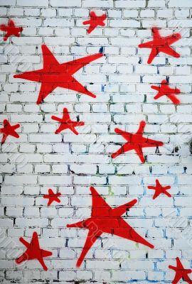 Red Stars on White Brick Wall