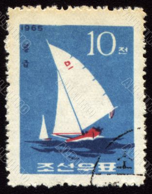 Yacht in a sea on post stamp