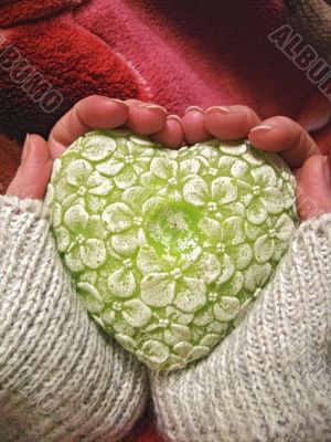 Valentine heart and heart shape candle in woman hands Valentine heart and heart shape candle in woman hands