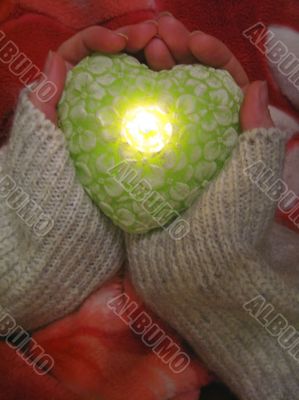 Valentine heart and heart shape candle in woman hands Valentine heart and heart shape candle in woman hands
