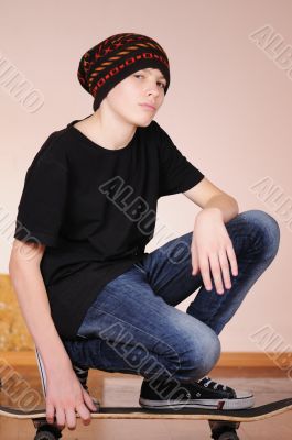 The teenager with a skateboard 