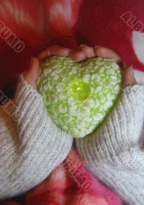 Valentine heart and heart shape candle in woman hands Valentine heart and heart shape candle in woman hands
