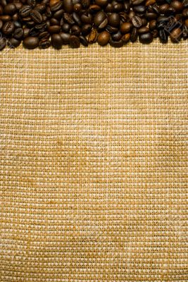 Background of the roasted coffee beans and burlap