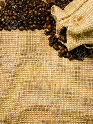 Background of the roasted coffee beans and burlap