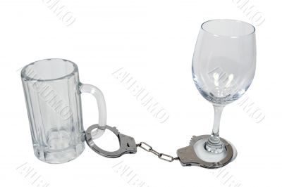 Handcuffs on Beer Mug and Wine Glass