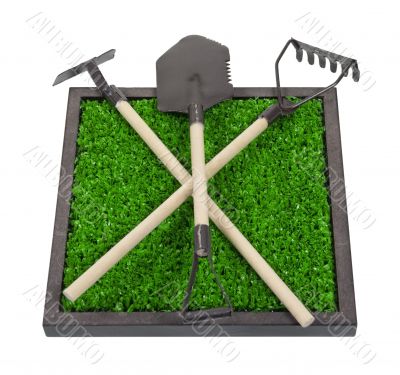 Gardening Tools on a Bed of Raised Grass