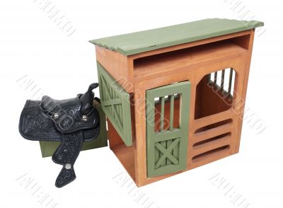 Saddle Hanging on Wooden Shed