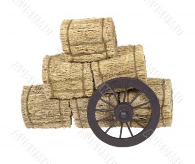 Stagecoach Wheel Leaning on Bales of Hay
