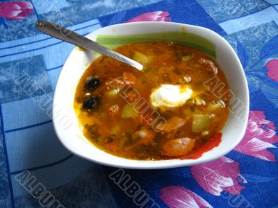 Plate with tasty soup on the table