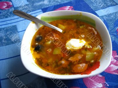 Plate with tasty soup on the table