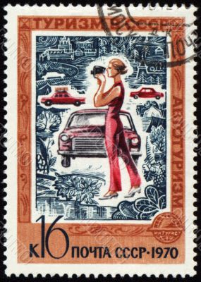 Woman with the camera on post stamp