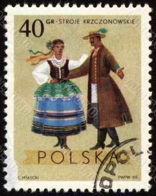 Polish folk dancers from Krzczonowskie region on post stamp