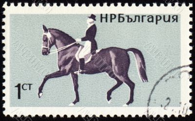 Horse with rider on post stamp