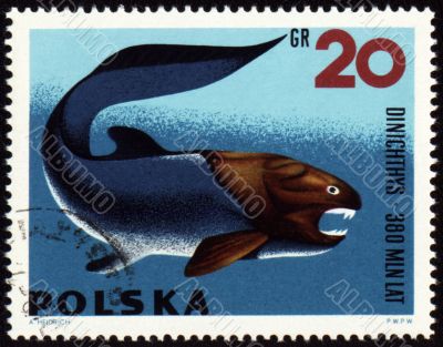 Prehistoric fish Dinichthys on post stamp