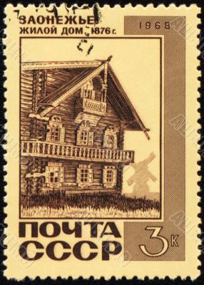 Old wooden house on post stamp