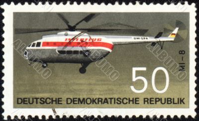 Flying helicopter Mi-8 on post stamp