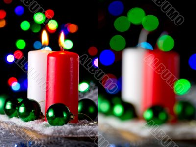 Red and white candle with a green New Year`s ball Red and white candle with a green New Year`s ball