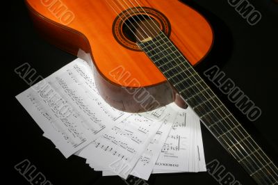 Guitar and music sheet Guitar and music sheet