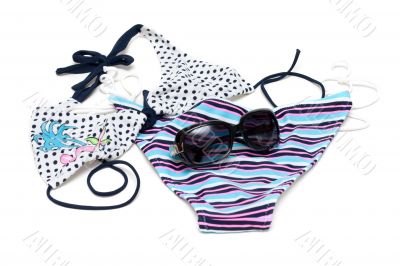 Sunglasses to rest upon swimsuit