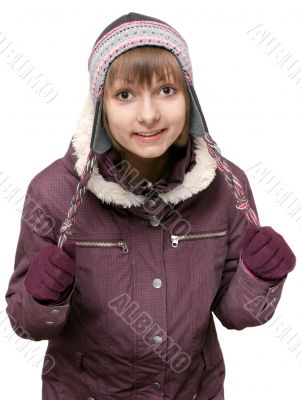 Young beautiful girl in winter to jacket and hat