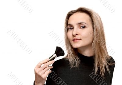 Portrait beautiful girl with make-up brush